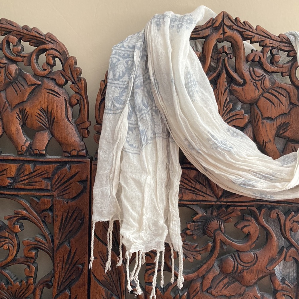 Lightweight, white and light blue pattern scarf. 72 inches long, 16 inches wide.
